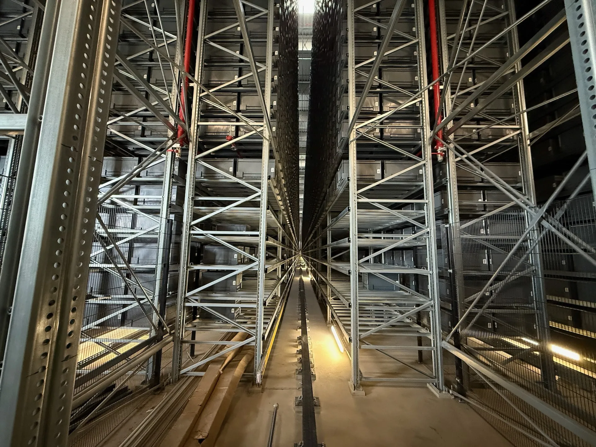 View into a high-bay warehouse aisle – drone inspection